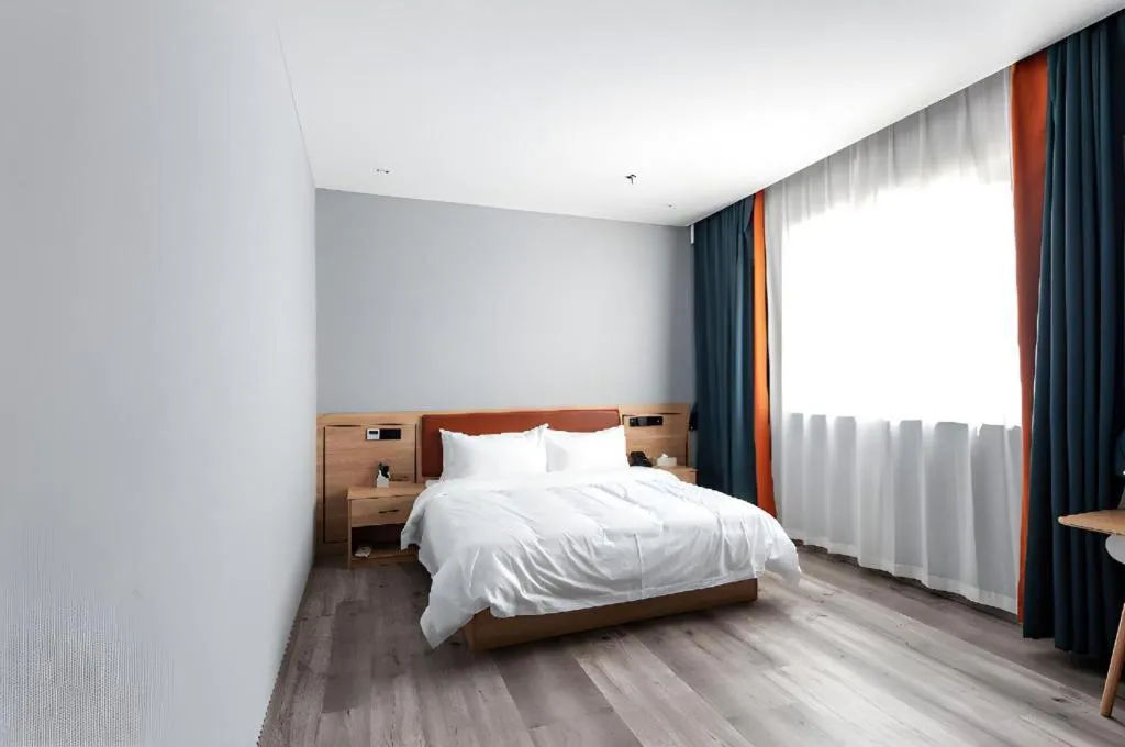 Bed in Borrman Hotel Jiangyin Zhouzhuang