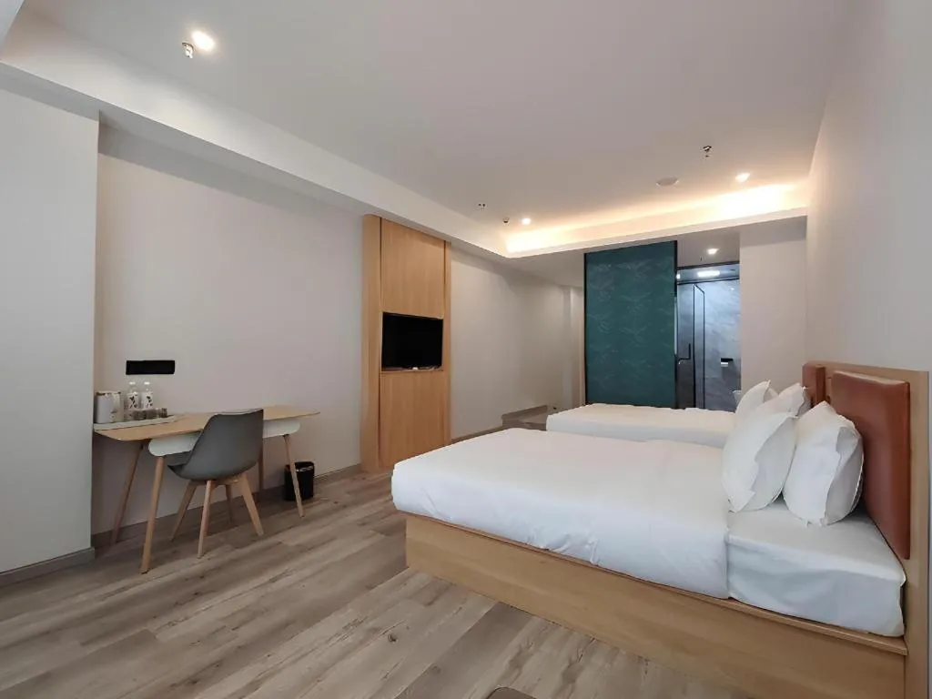 Bed in Borrman Hotel Jiangyin Zhouzhuang