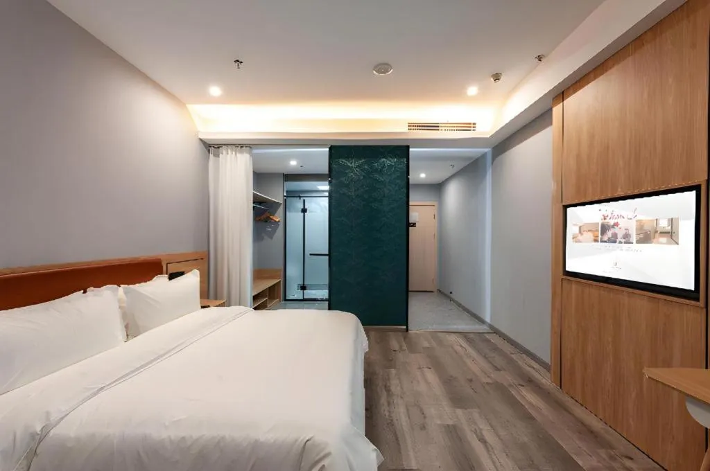 Bed in Borrman Hotel Jiangyin Zhouzhuang