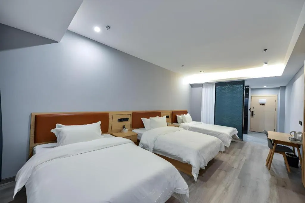 Bed in Borrman Hotel Jiangyin Zhouzhuang