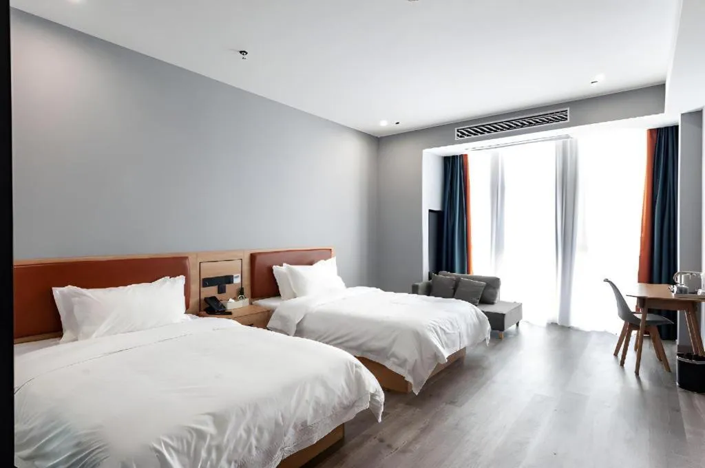 Bed in Borrman Hotel Jiangyin Zhouzhuang