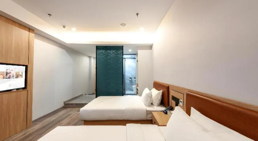 Bed in Borrman Hotel Jiangyin Zhouzhuang