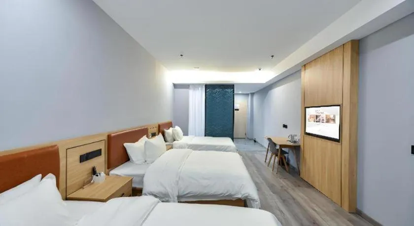 Bed in Borrman Hotel Jiangyin Zhouzhuang