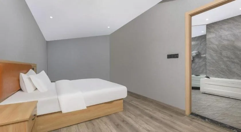 Bed in Borrman Hotel Jiangyin Zhouzhuang