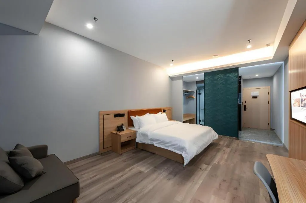 Bed in Borrman Hotel Jiangyin Zhouzhuang