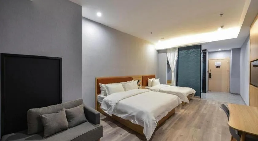 Bed in Borrman Hotel Jiangyin Zhouzhuang