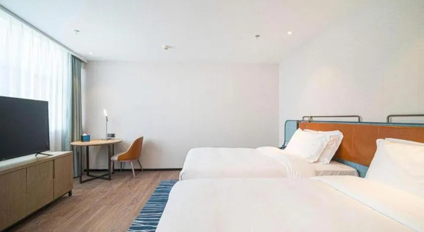 Bed in Echarm Hotel Nanjing Expo Center Olympic East Metro Station