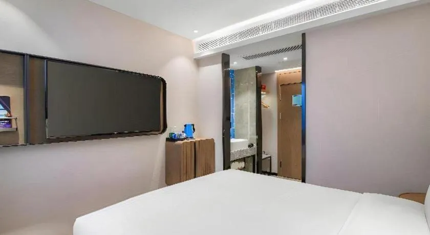 Bed in Echarm Hotel Nanjing Expo Center Olympic East Metro Station