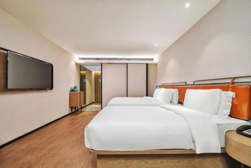 Bed in Echarm Hotel Nanjing Expo Center Olympic East Metro Station