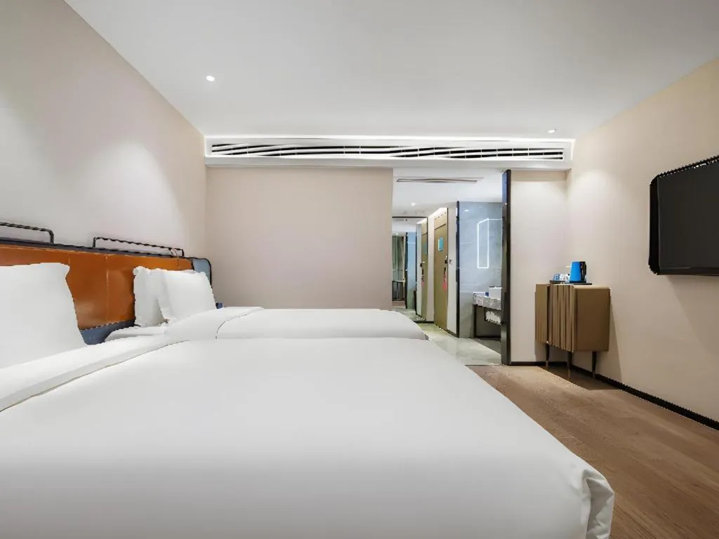 Bed in Echarm Hotel Nanjing Expo Center Olympic East Metro Station