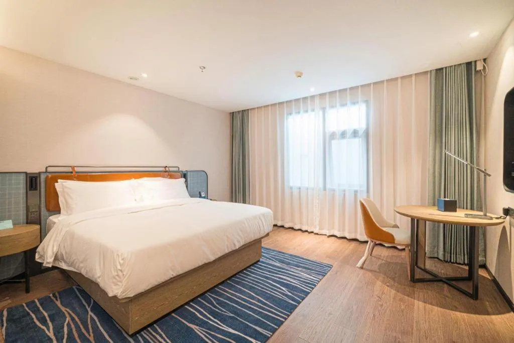 Bed in Echarm Hotel Nanjing Expo Center Olympic East Metro Station