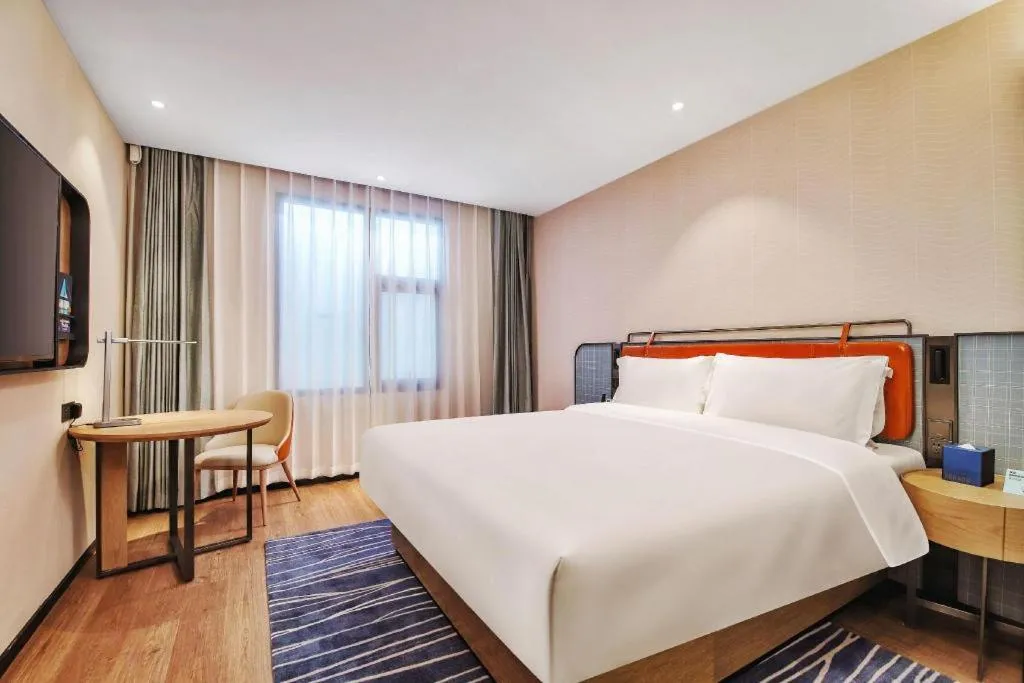 Bed in Echarm Hotel Nanjing Expo Center Olympic East Metro Station