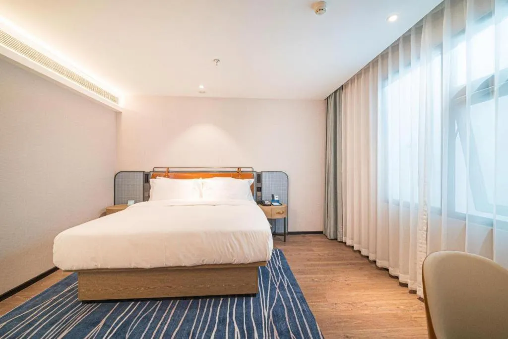 Bed in Echarm Hotel Nanjing Expo Center Olympic East Metro Station