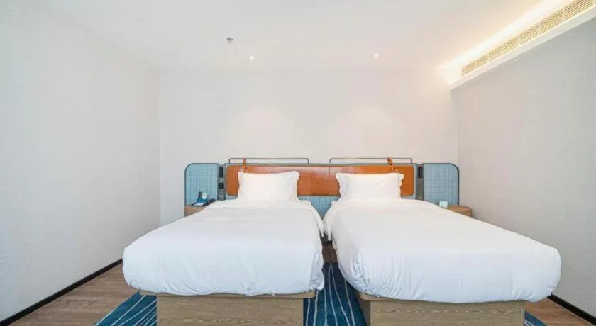 Bed in Echarm Hotel Nanjing Expo Center Olympic East Metro Station