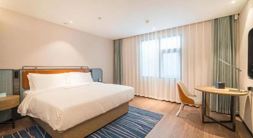 Bed in Echarm Hotel Nanjing Expo Center Olympic East Metro Station