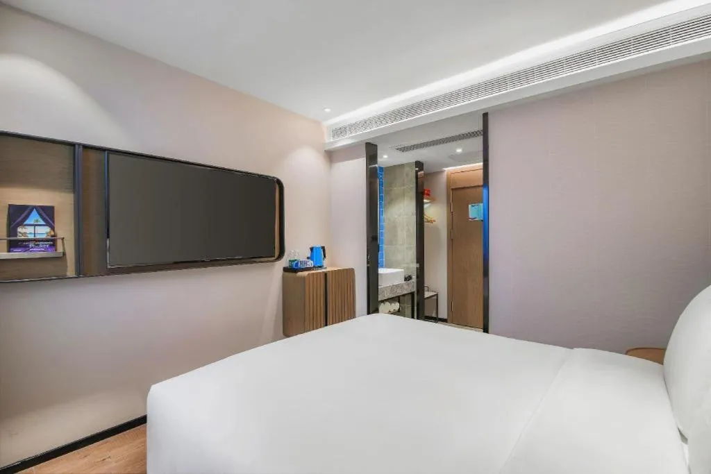 Bed in Echarm Hotel Nanjing Expo Center Olympic East Metro Station