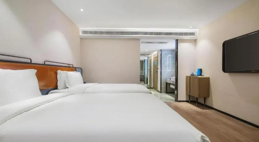 Bed in Echarm Hotel Nanjing Expo Center Olympic East Metro Station