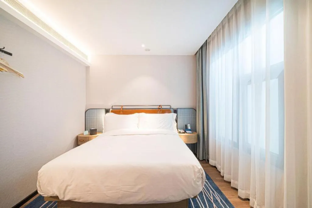 Bed in Echarm Hotel Nanjing Expo Center Olympic East Metro Station