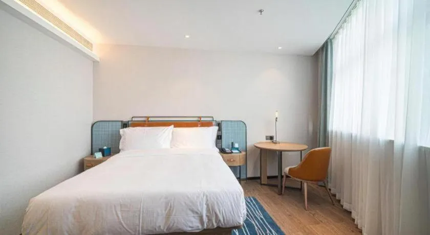 Bed in Echarm Hotel Nanjing Expo Center Olympic East Metro Station