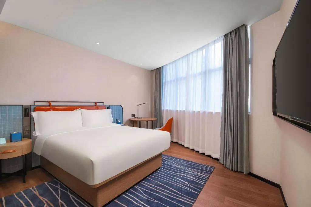 Bed in Echarm Hotel Nanjing Expo Center Olympic East Metro Station