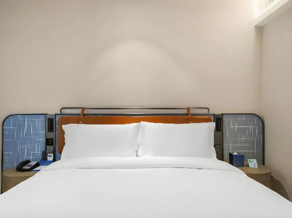 Bed in Echarm Hotel Nanjing Expo Center Olympic East Metro Station