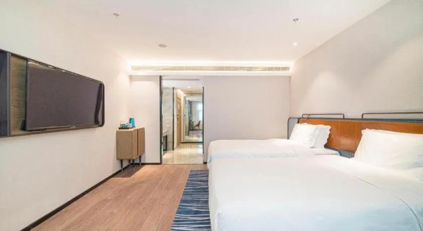 Bed in Echarm Hotel Nanjing Expo Center Olympic East Metro Station