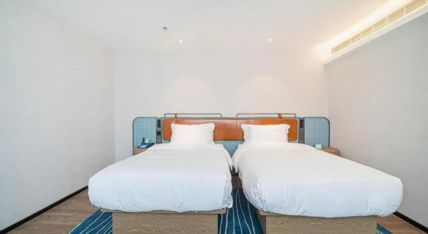 Bed in Echarm Hotel Nanjing Expo Center Olympic East Metro Station