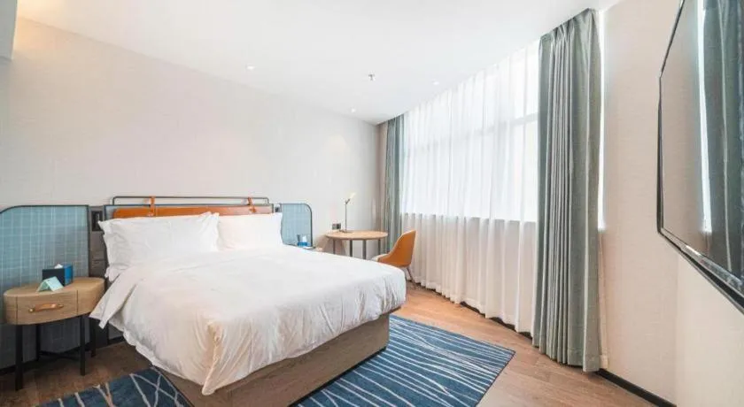 Bed in Echarm Hotel Nanjing Expo Center Olympic East Metro Station