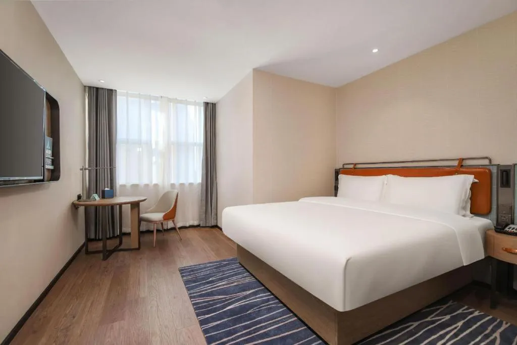 Bed in Echarm Hotel Nanjing Expo Center Olympic East Metro Station