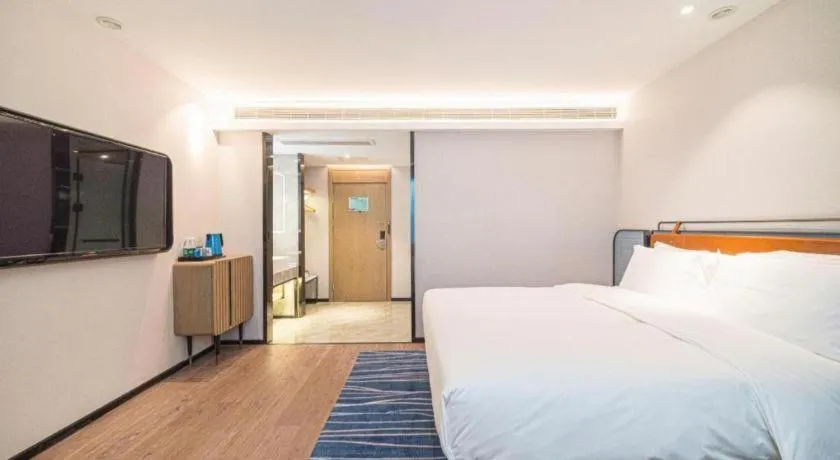 Bed in Echarm Hotel Nanjing Expo Center Olympic East Metro Station