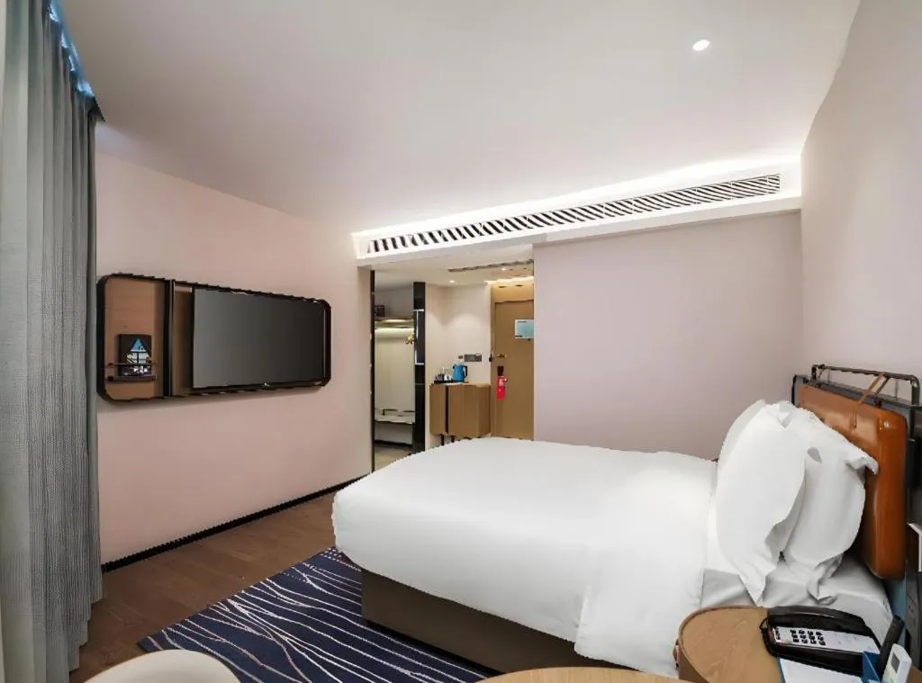 Bed in Echarm Hotel Nanjing Expo Center Olympic East Metro Station