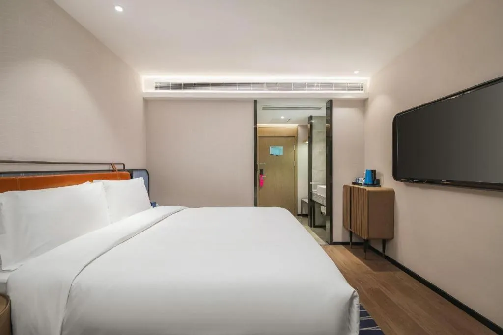 Bed in Echarm Hotel Nanjing Expo Center Olympic East Metro Station