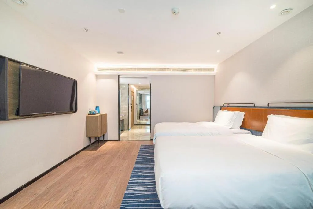 Bed in Echarm Hotel Nanjing Expo Center Olympic East Metro Station