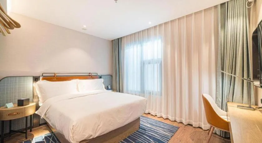 Bed in Echarm Hotel Nanjing Expo Center Olympic East Metro Station