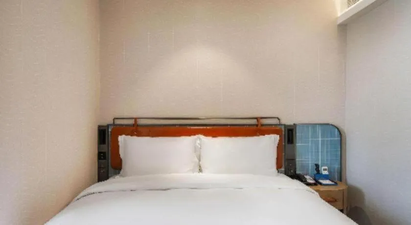 Bed in Echarm Hotel Nanjing Expo Center Olympic East Metro Station