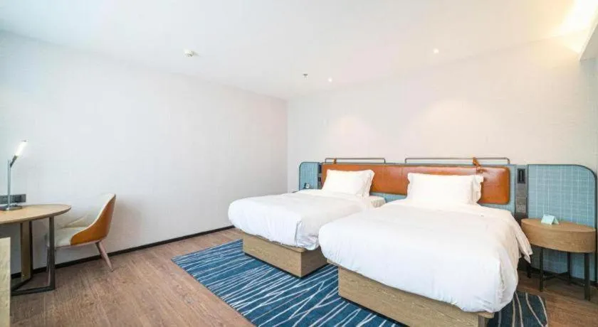 Bed in Echarm Hotel Nanjing Expo Center Olympic East Metro Station