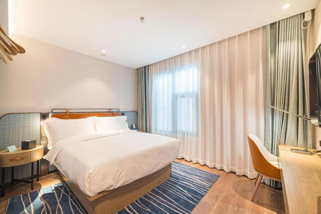 Bed in Echarm Hotel Nanjing Expo Center Olympic East Metro Station