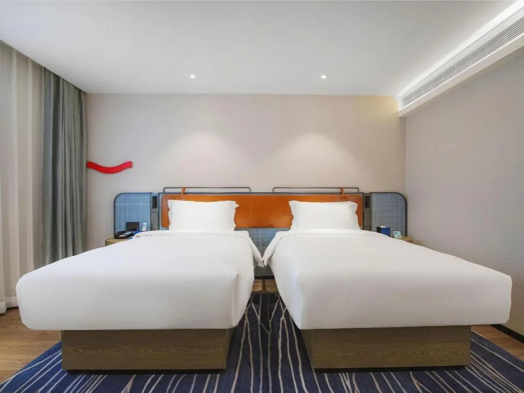 Bed in Echarm Hotel Nanjing Expo Center Olympic East Metro Station
