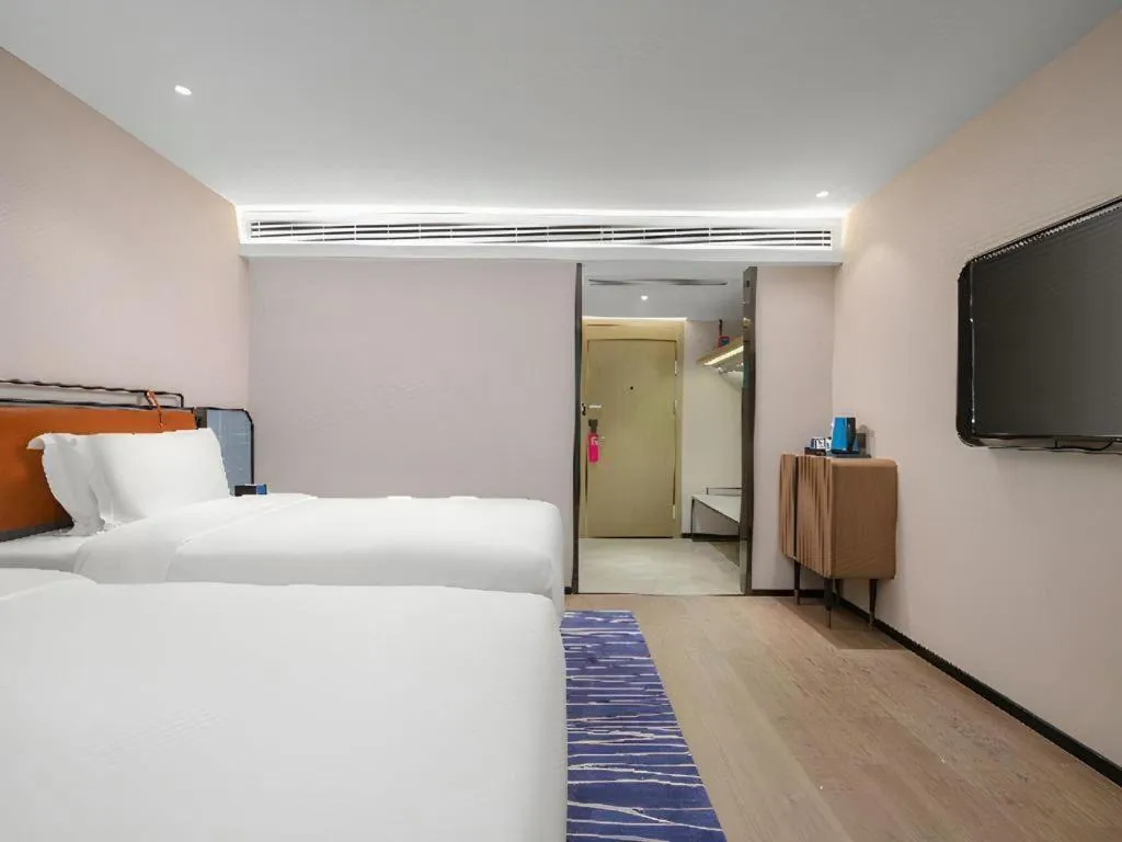 Bed in Echarm Hotel Nanjing Expo Center Olympic East Metro Station