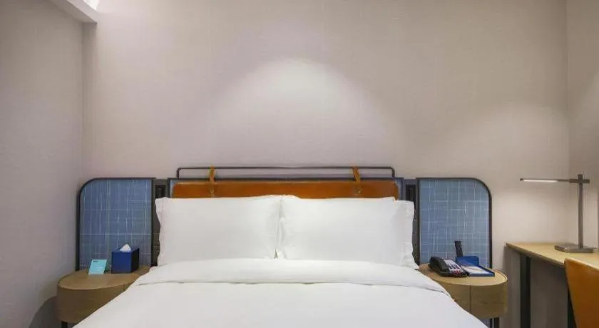 Bed in Echarm Hotel Nanjing Expo Center Olympic East Metro Station