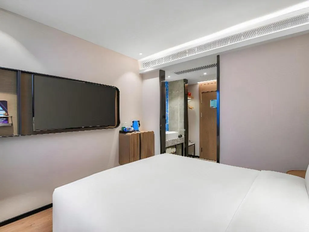 Bed in Echarm Hotel Nanjing Expo Center Olympic East Metro Station