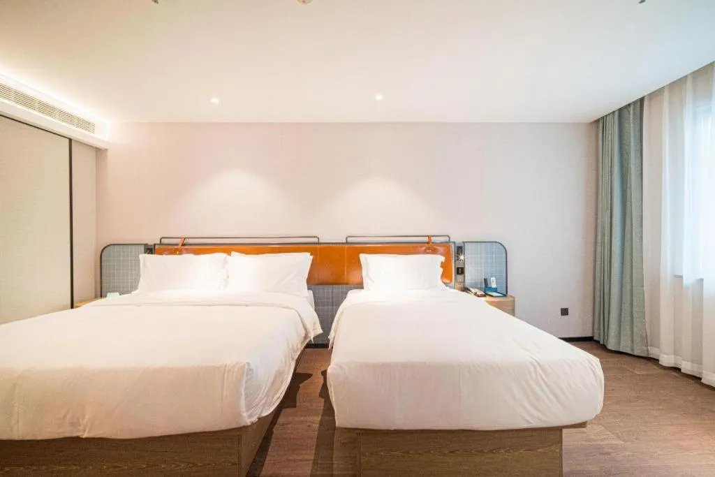 Bed in Echarm Hotel Nanjing Expo Center Olympic East Metro Station