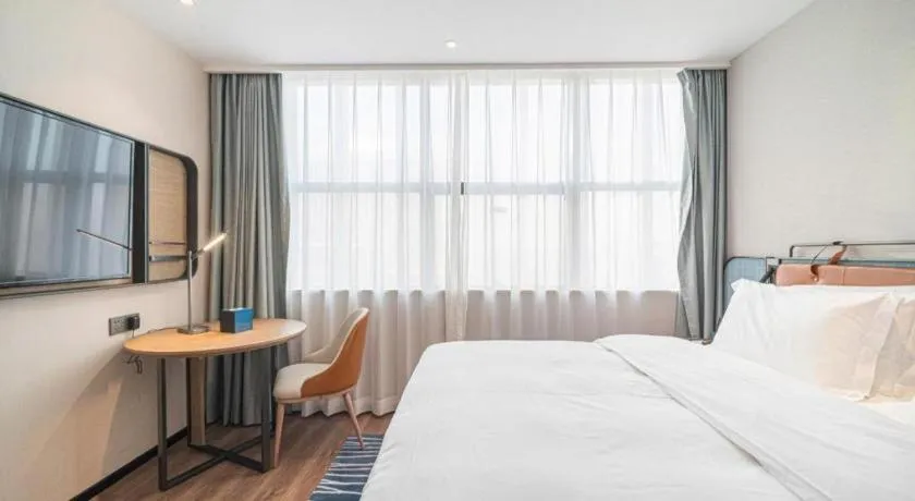 Bed in Echarm Hotel Nanjing Expo Center Olympic East Metro Station