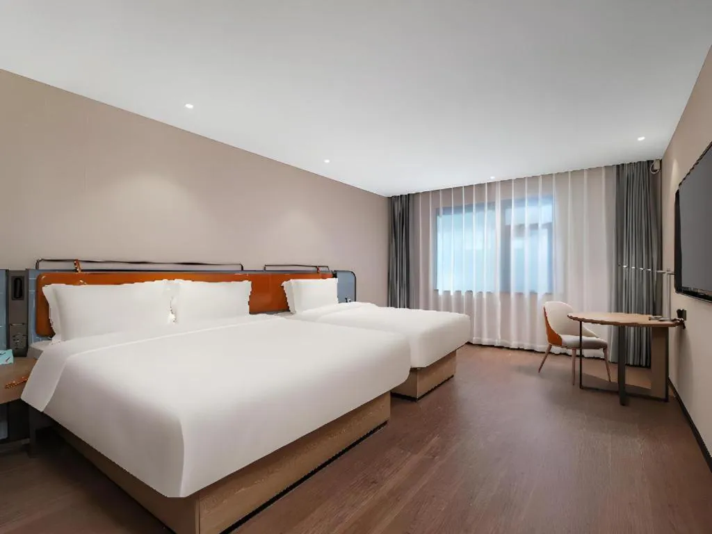 Bed in Echarm Hotel Nanjing Expo Center Olympic East Metro Station