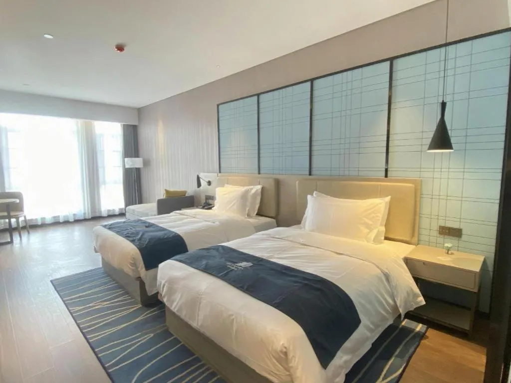 Bed in Echarm Hotel Wuhan Huashan