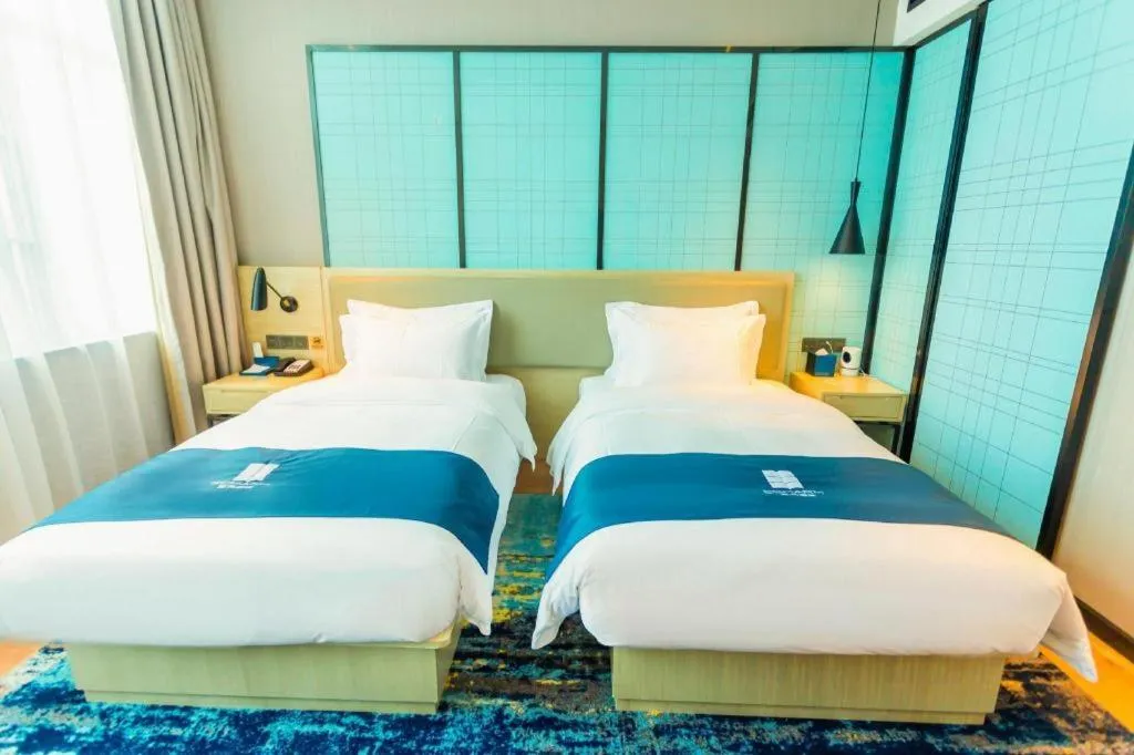 Bed in Echarm Hotel Wuhan Huashan