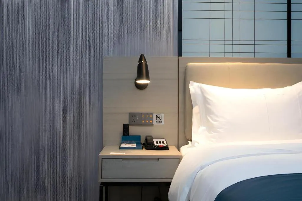 Bed in Echarm Hotel Wuhan Huashan