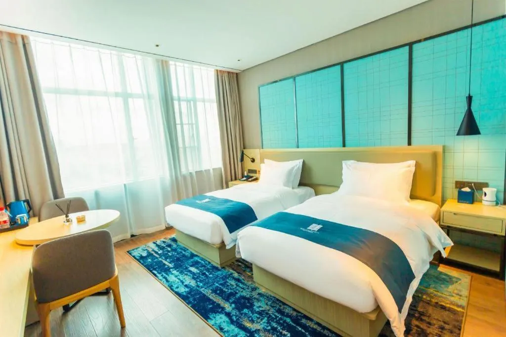 Bed in Echarm Hotel Wuhan Huashan