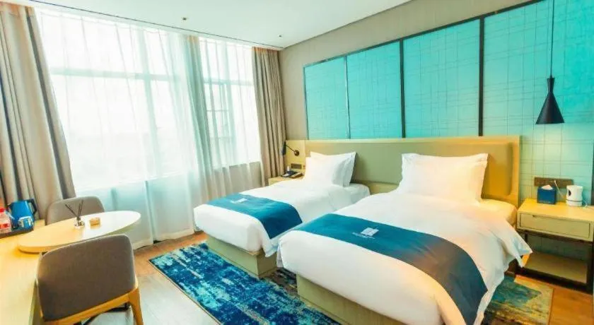 Bed in Echarm Hotel Wuhan Huashan