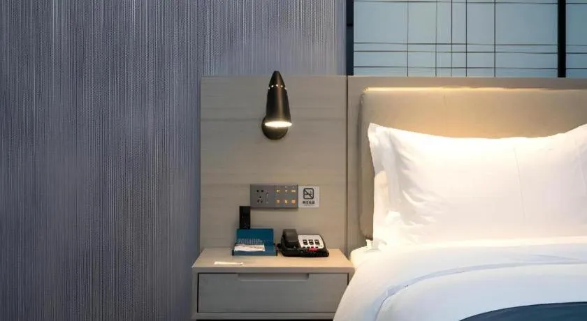 Bed in Echarm Hotel Wuhan Huashan